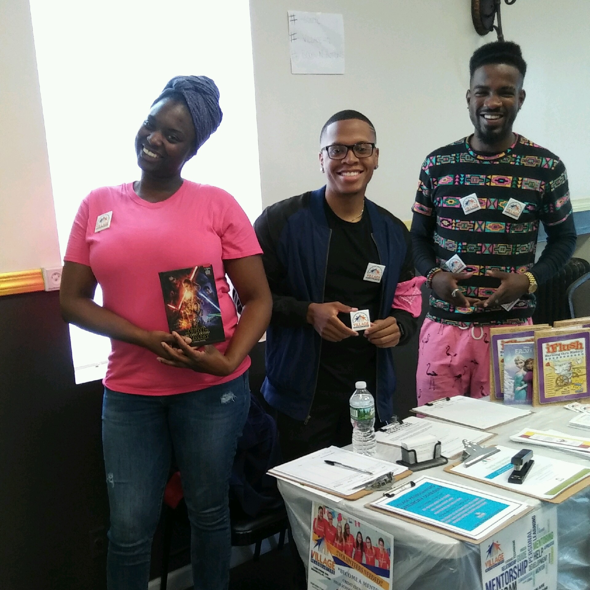 Village Headquarters volunteers at a mentorship outreach table