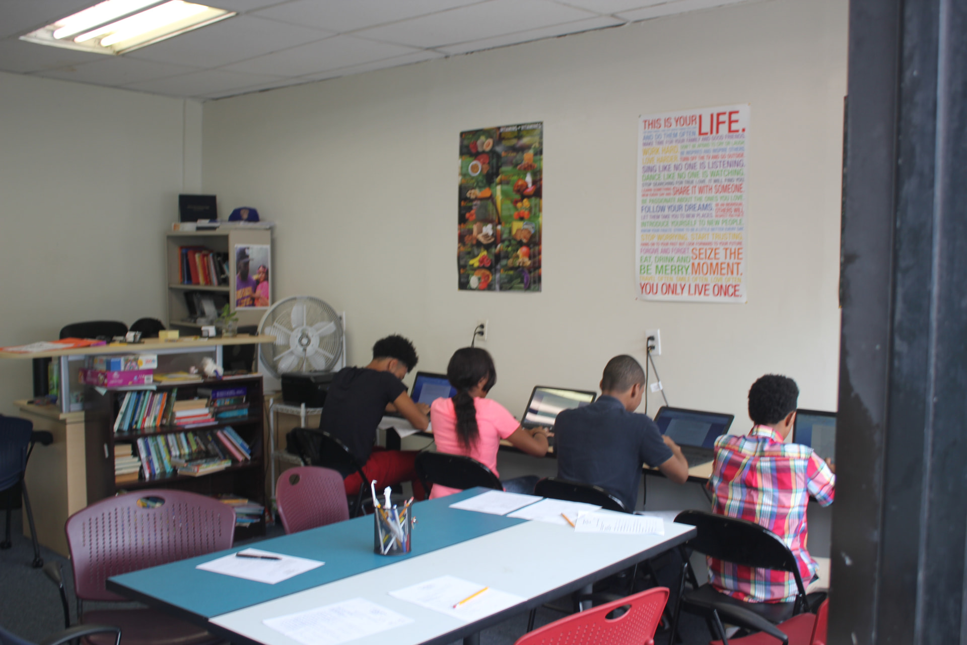 Youth working on laptops in the computer lab